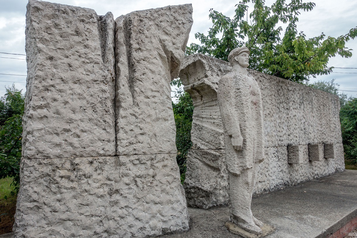 A worker -- quite literally -- breaking through a wall of oppression at Budapest's Memento Park