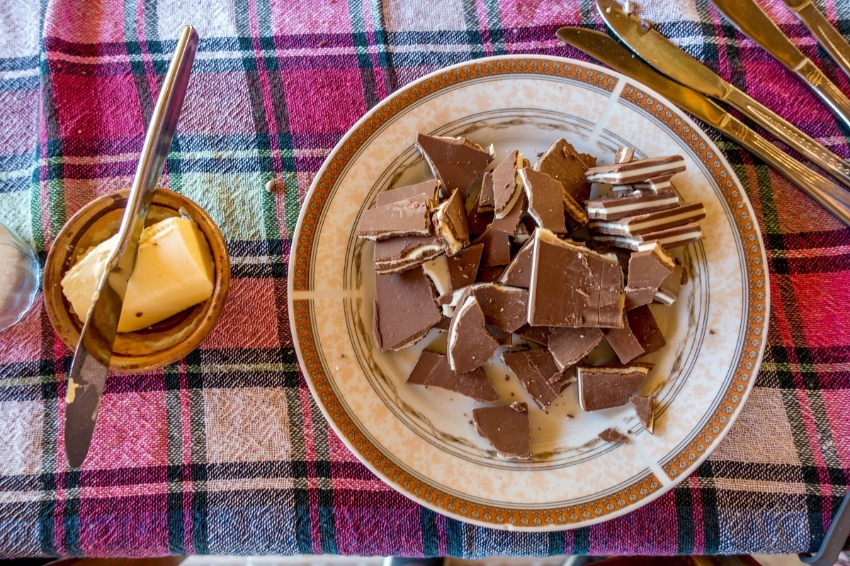 Breaking up chocolate in our cooking class at Risto's Gust House in Ohrid.