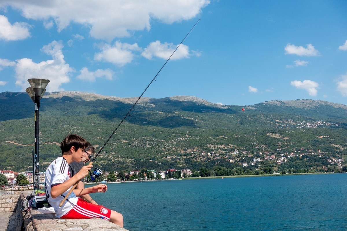Fishing from the promenade in Lake Ohrid Macedonia.