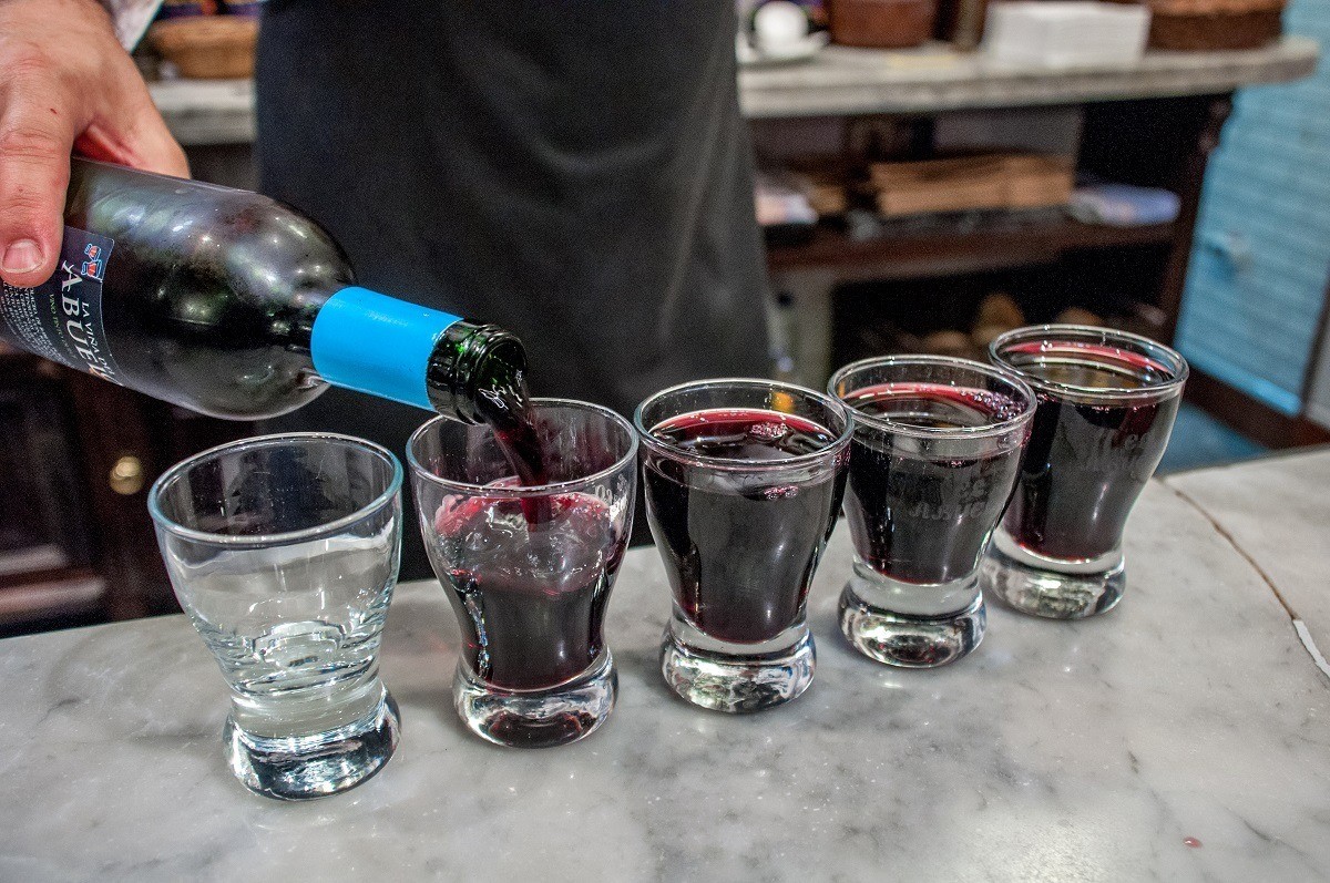 Trying some wine during a food tour in Madrid, Spain