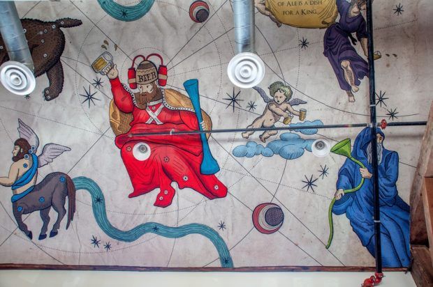 The beer and cherub ceiling mural at the Happy Valley Brewery.