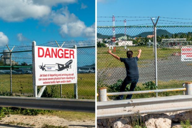 Warning signs tell visitors not to fence surf at Princess Juliana International Airport in St Maarten Maho Beach