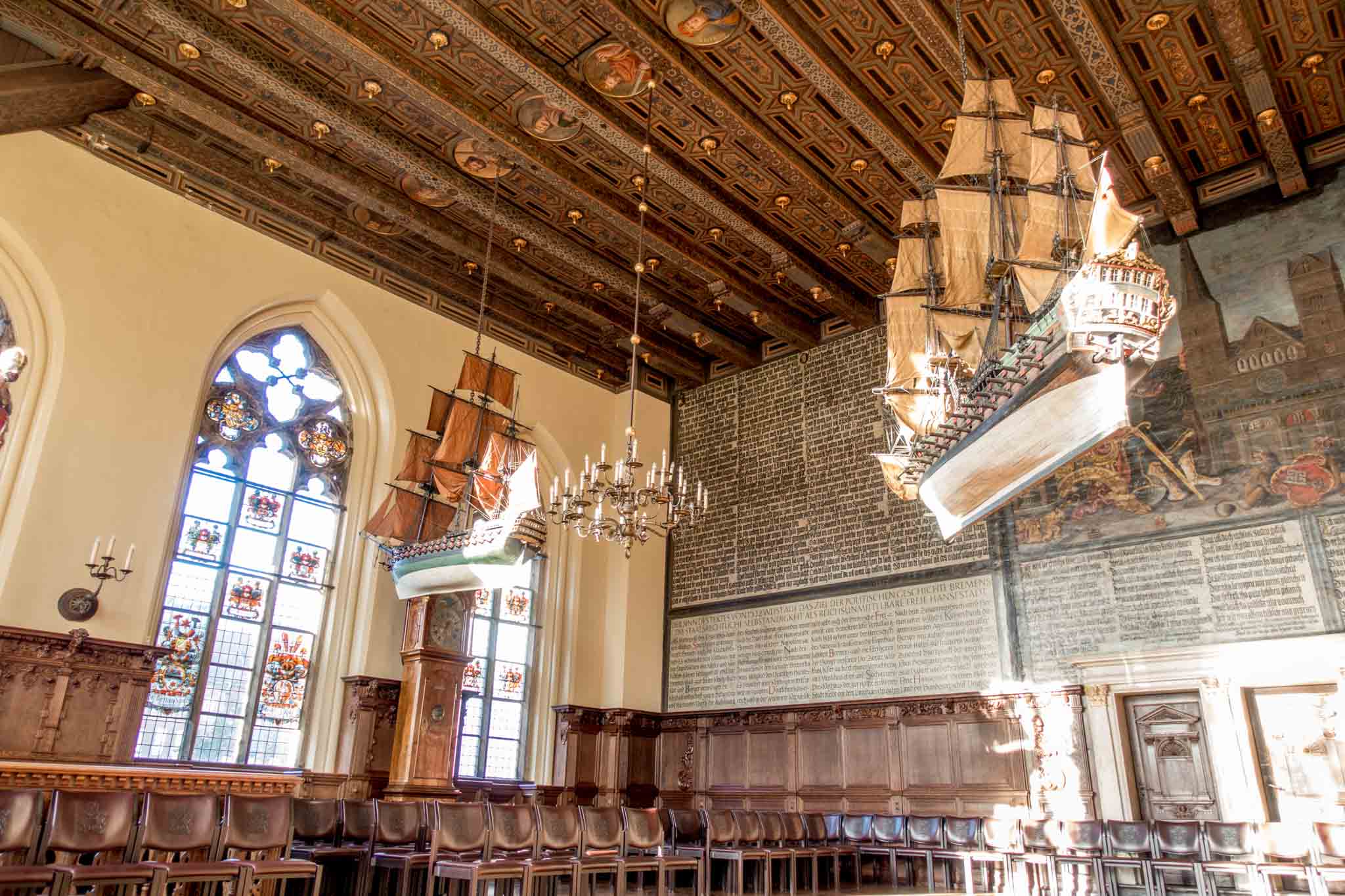 Room in Bremen City Hall with replica ships hanging from ceiling