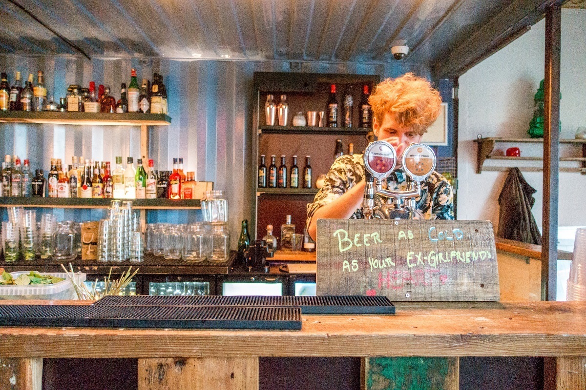 Man pouring "beer as cold as your ex-girlfriend's heart"