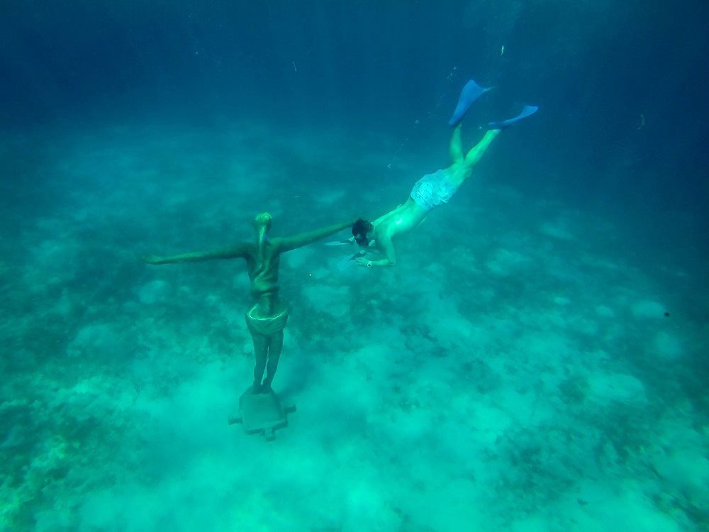 The best snorkel gear will let you see interesting things like statues underwater easily and safely.