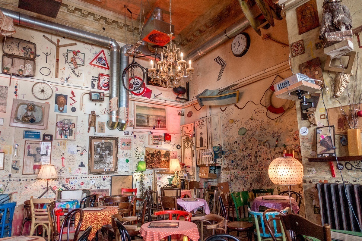 Drawings and photos on the walls at Csendes Vintage Bar