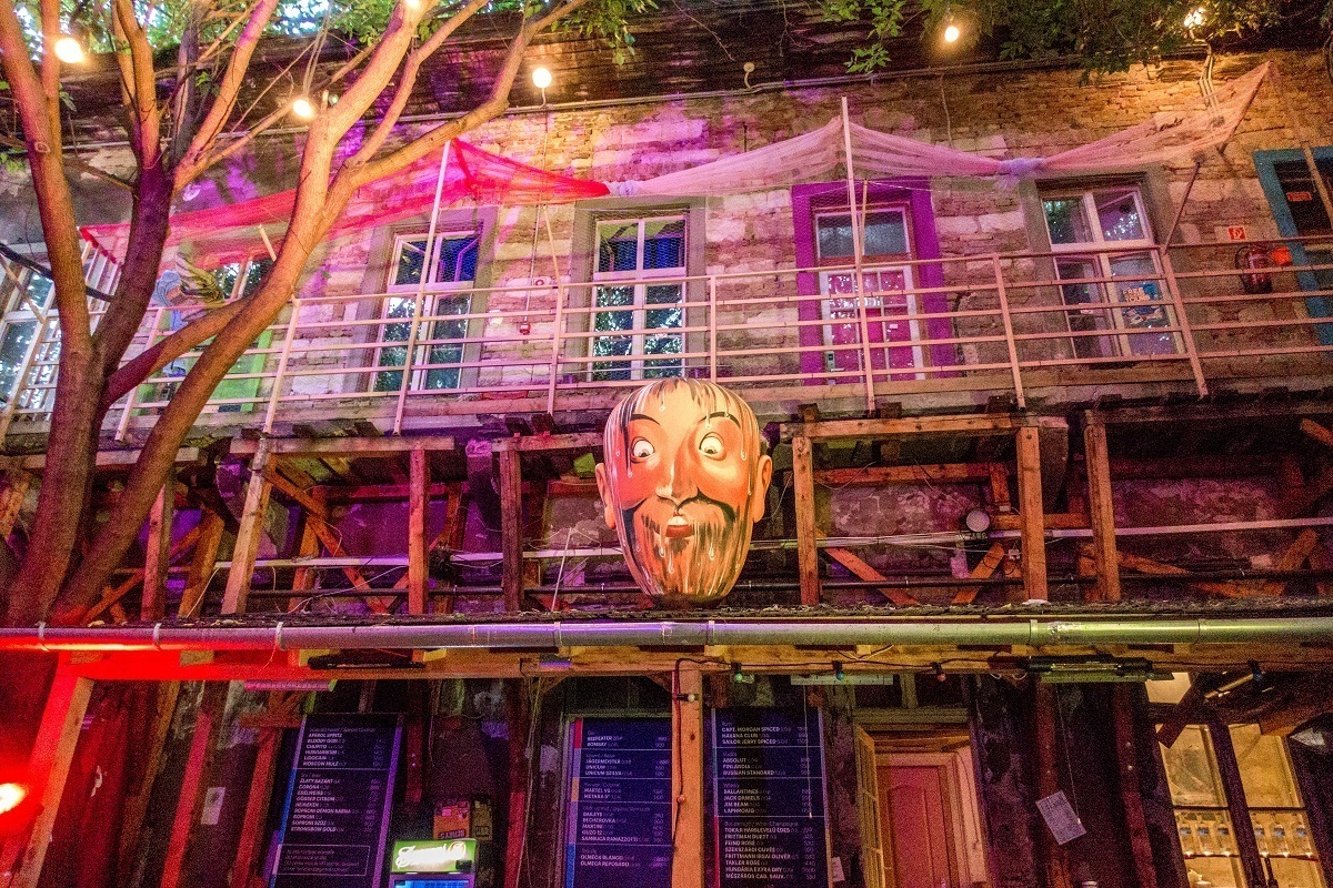 Caricature head outside entrance to Fogas Haz