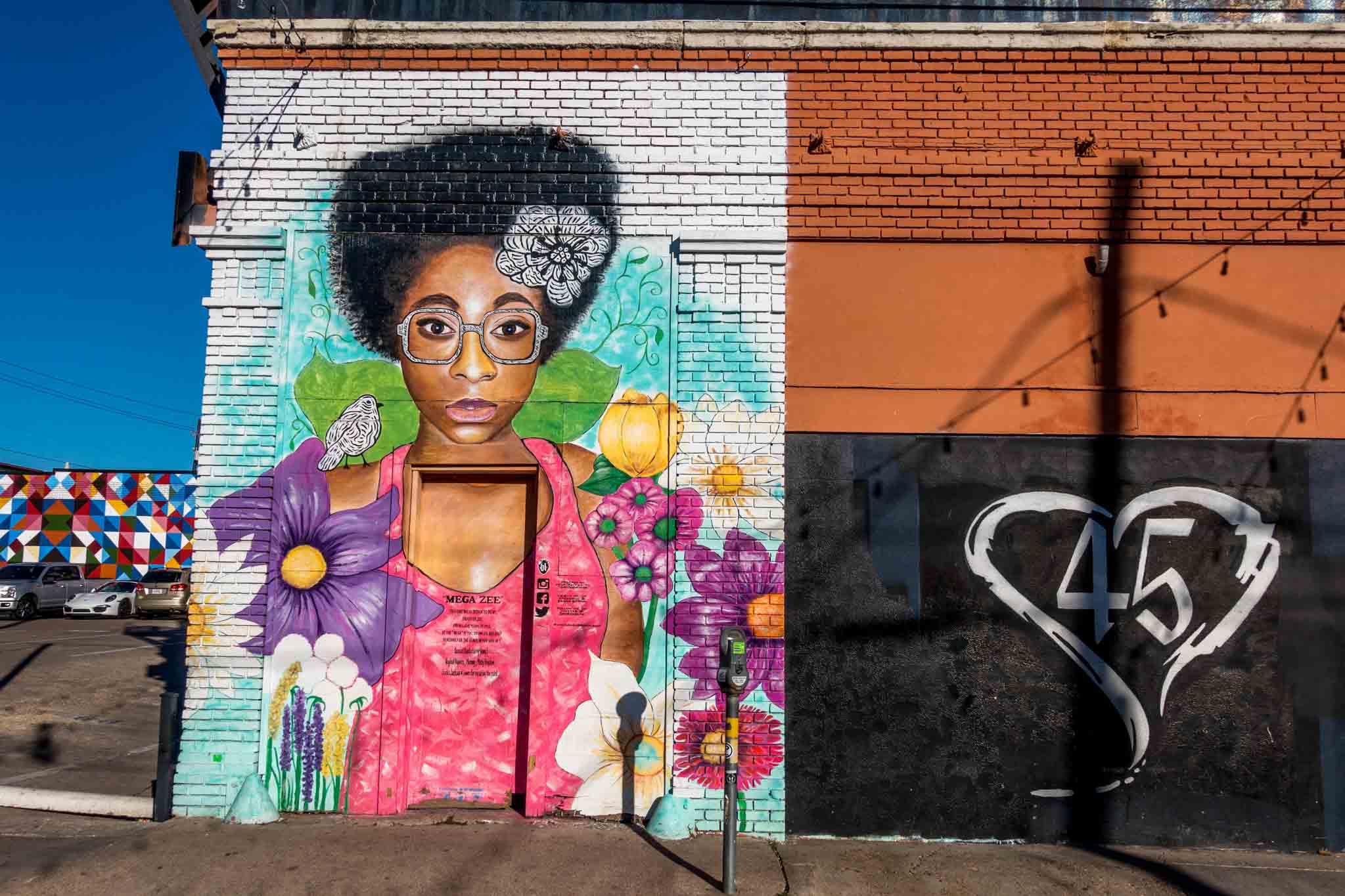 Street art in Deep Ellum showing woman with bright flowers