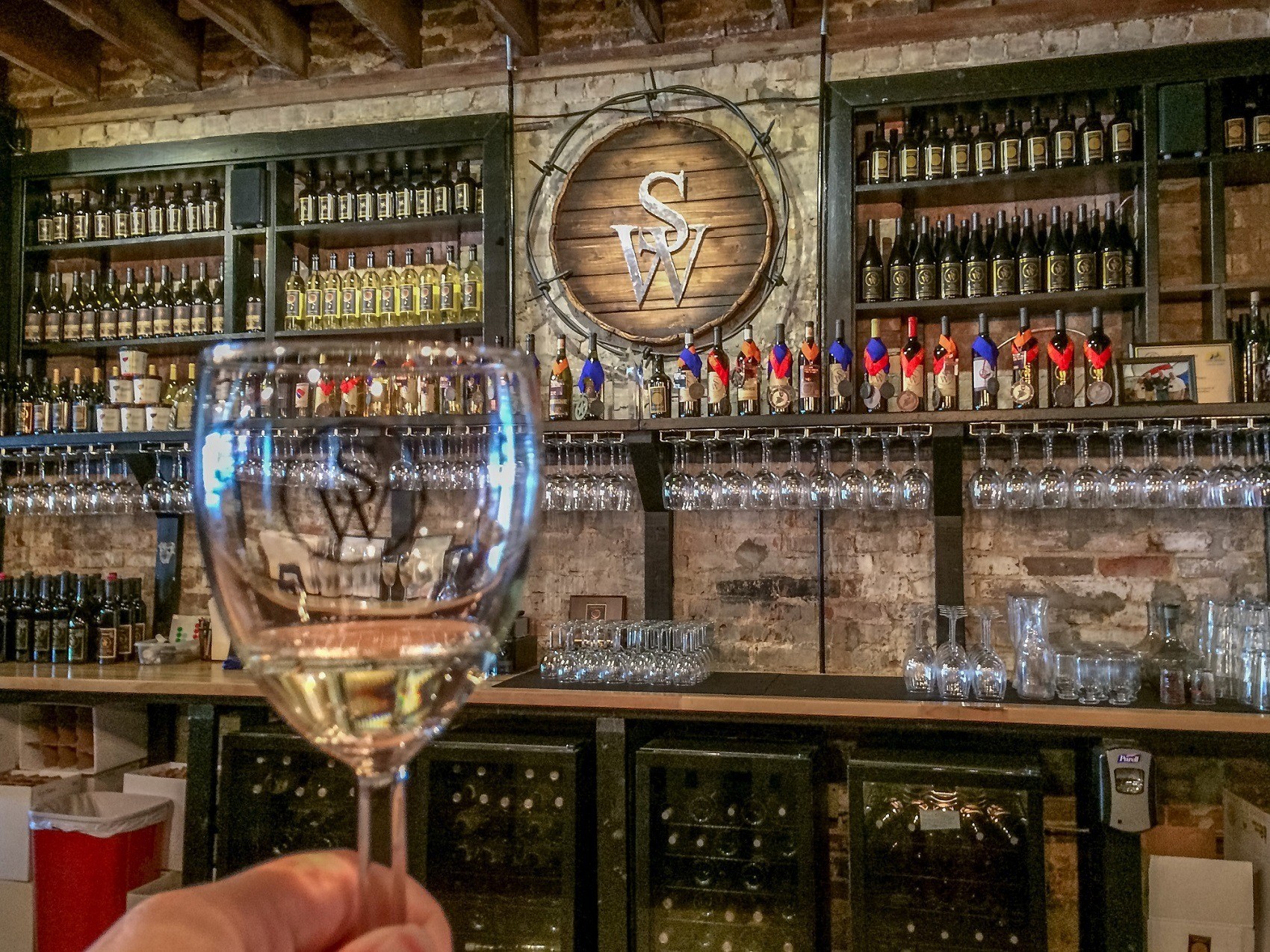 Wine glass and bar at Sloan & Williams Winery