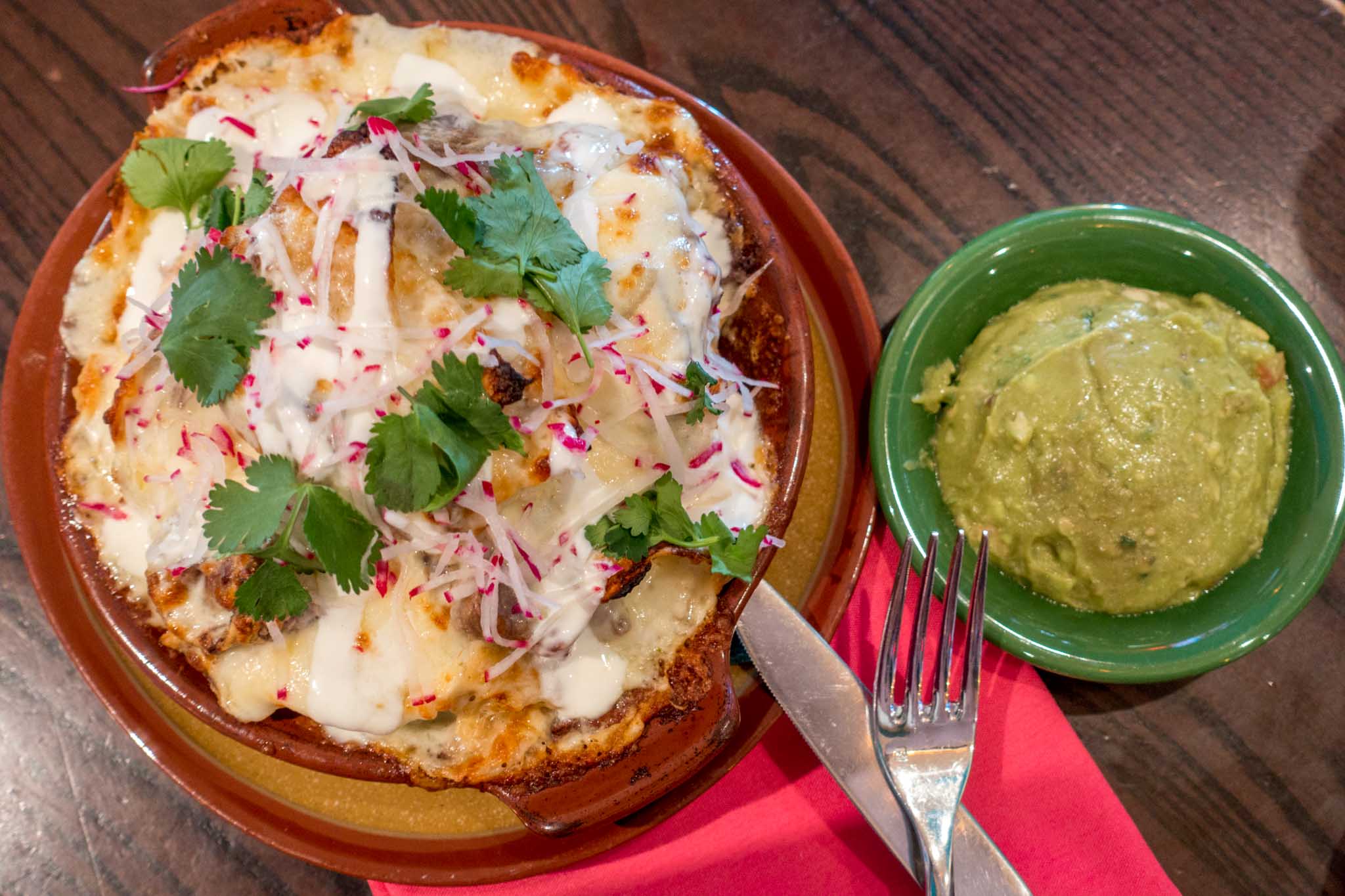 Nachos and guacamole on a table
