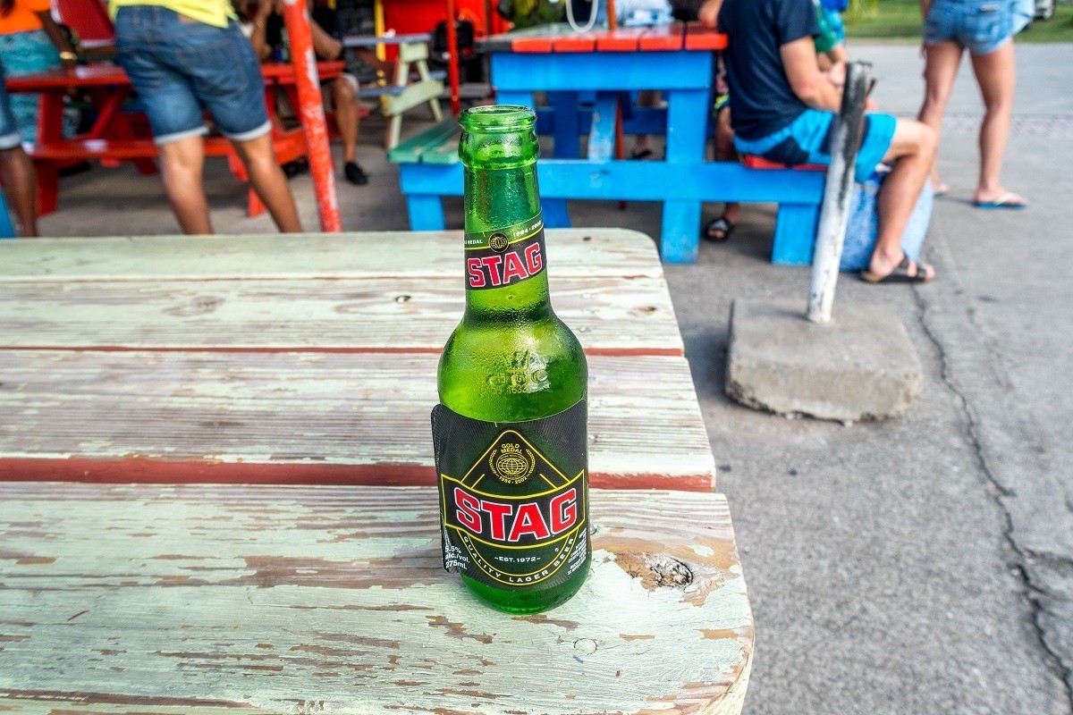 Bottle of Stag Beer in St. Kitts on a picnic table