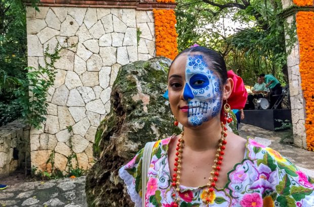 Celebrating Day of the Dead in Mexico Woman with her face painted for the Day of the Dead festival at Xcaret in Playa del Carmen, Mexico