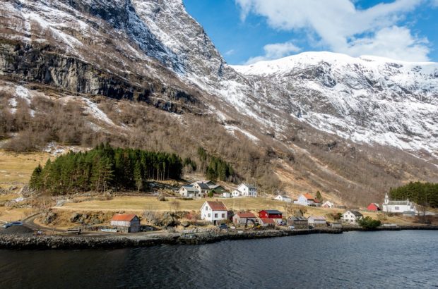 How to do Norway in a Nutshell on Your Own Houses along one of the Norway fjords seen on a Norway in a Nutshell tour