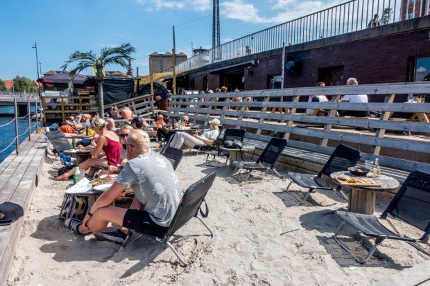 The beach at Kayak Bar in Copenhagen is unexpected and a fun place to hang out