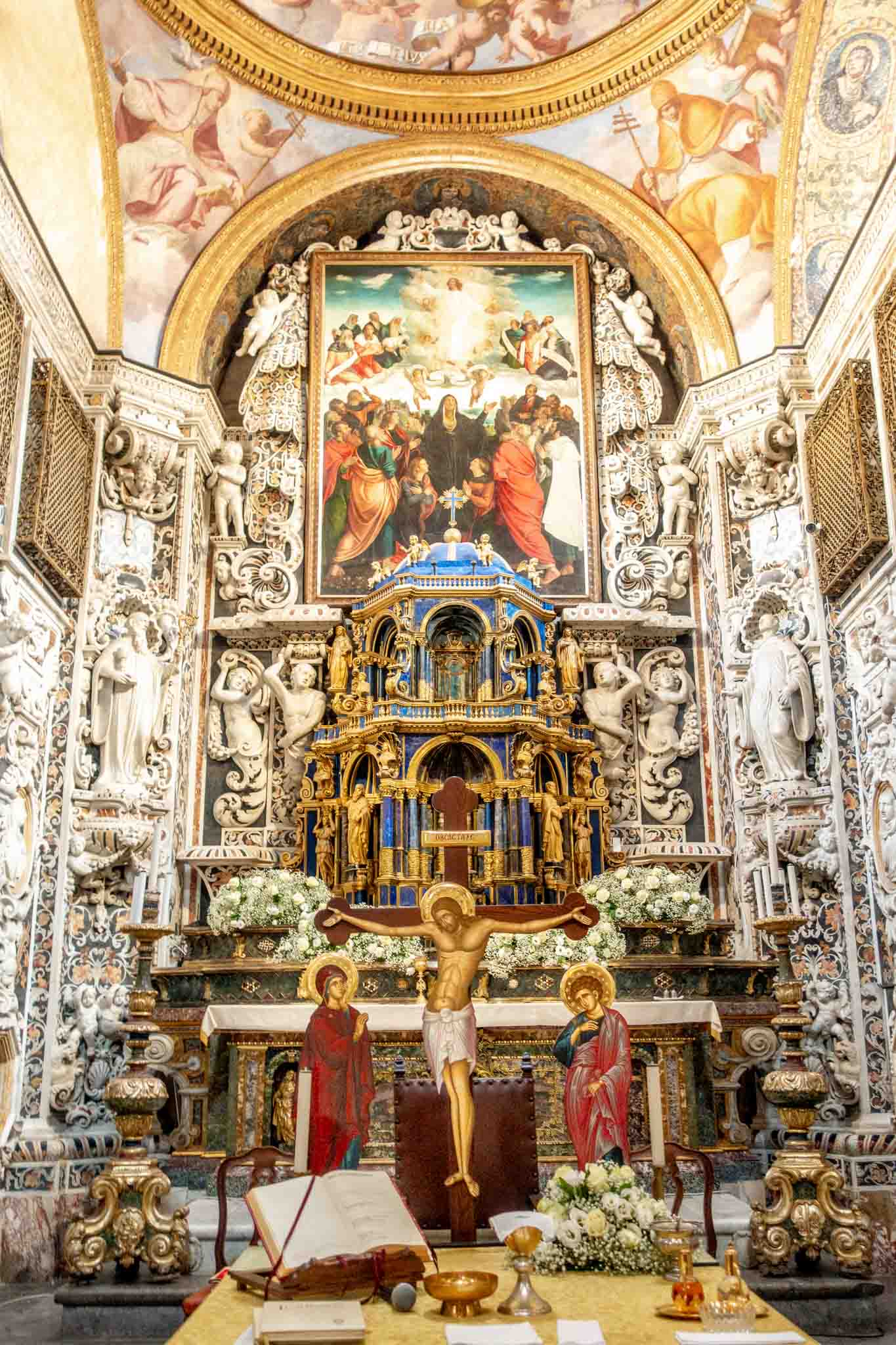 The elaborate carved marble altar at Martorana church with painting of Jesus