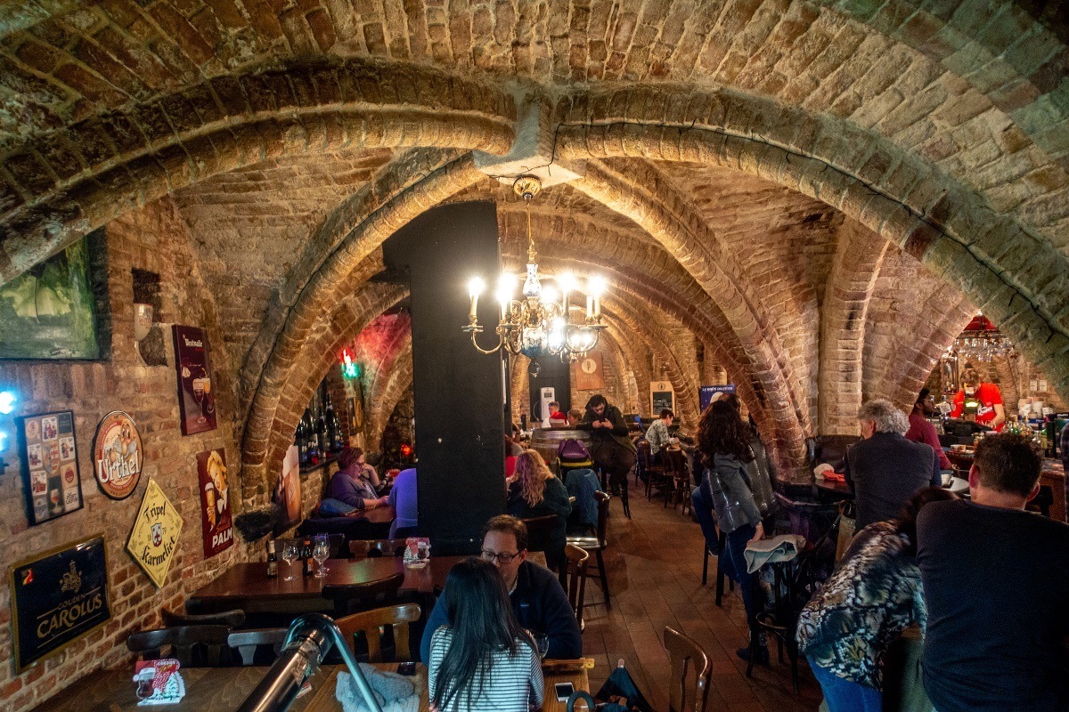 Visiting the underground Le Trappiste beer bar is what to do in Bruges Belgium near Market Square