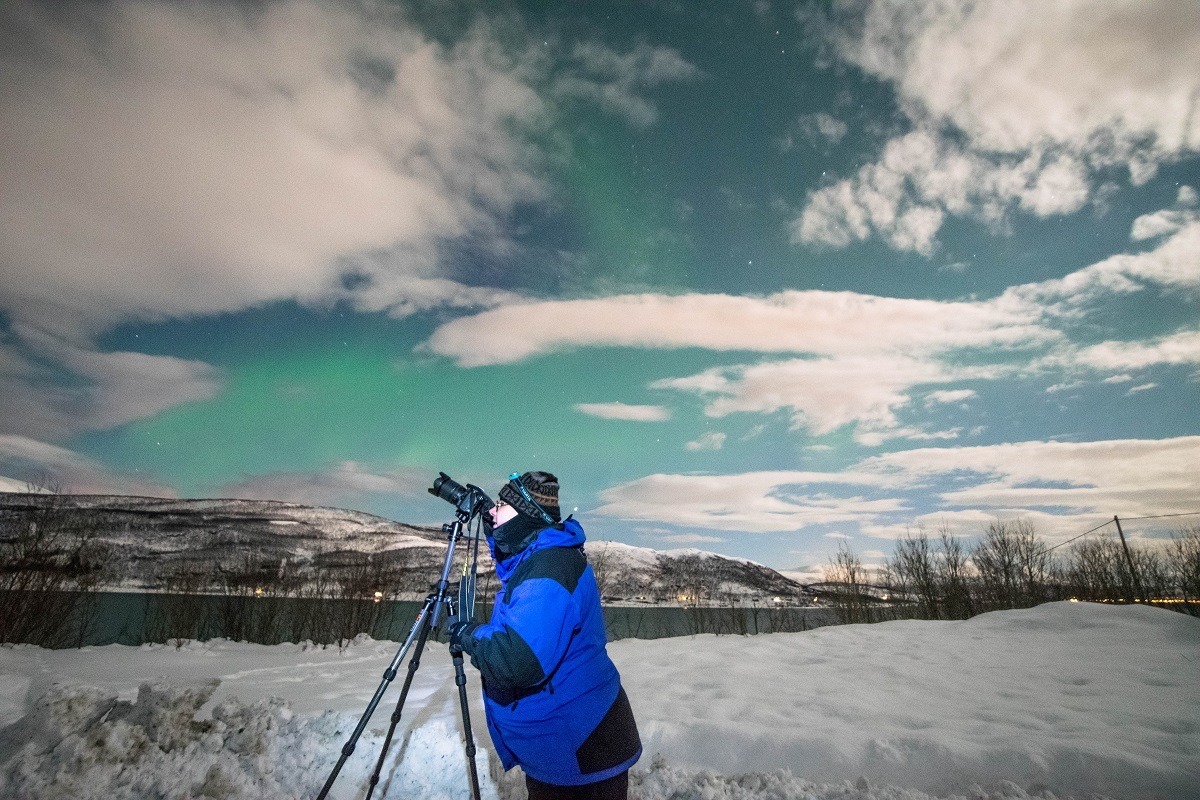 Photographing the northern lights in Tromso dressed in our heavy Norway winter clothing.