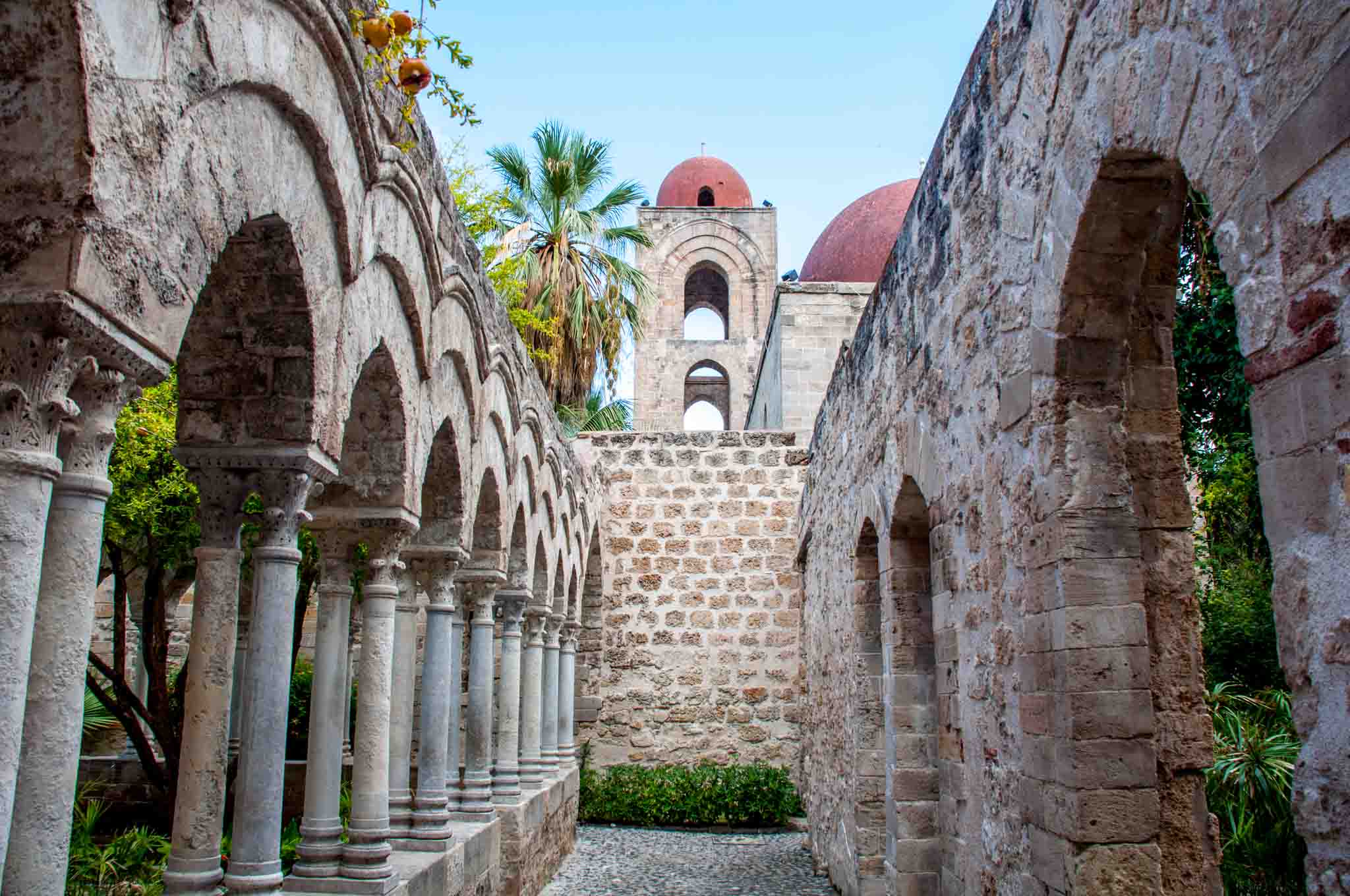 Stop at the gorgeous courtyard of St. John of the Hermits when you visit Palermo, Sicily