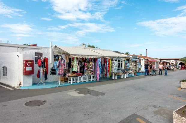 Visiting the beach town of Porto di Levante on Vulcano Island. There are a handful of shops for shopping and also a wine shop where you can sample Italian wine.