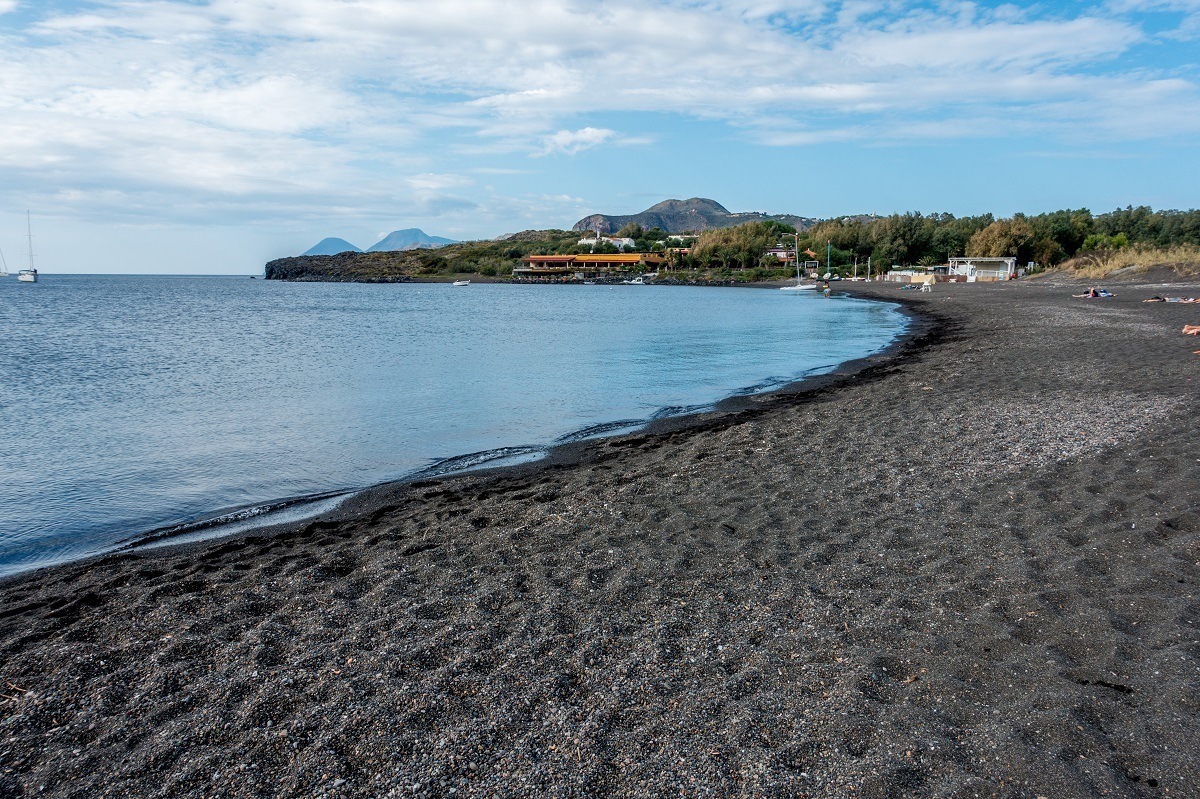 Relax at Porto di Ponente on the Spiaggia Sabbia Nera, a black sand beach