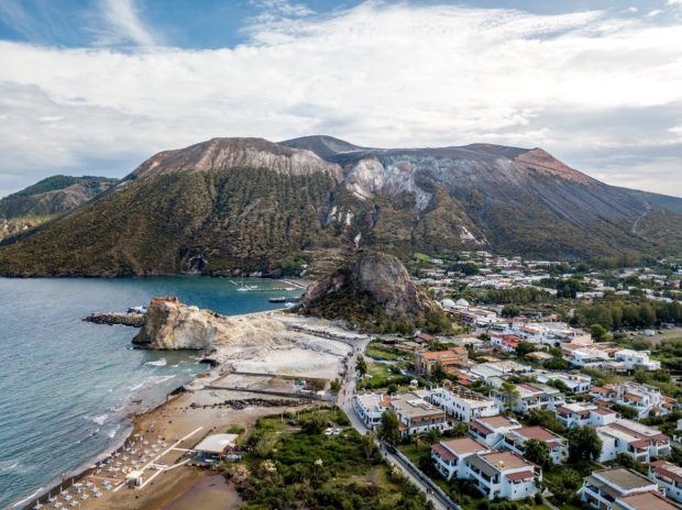 One of the top things to do on Vulcano Island is hiking the Grand Cratere above the town of Porto di Levante. (Aerial photo from drone of Vulcano Italy)