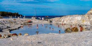 Slipping into the Vulcano Island Mud Baths Everything you need to know to visit the Vulcano Island mud baths in Italy. This includes things to do on Vulcano Island, how to get to Vulcano Island, tips for visiting the mud baths and hot springs, and also how to get to the black sand beach.