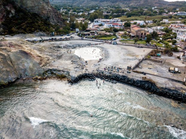 A quick dip in the ocean can help remove the mud from the mud baths. Beware of hot steam vents under the sand.