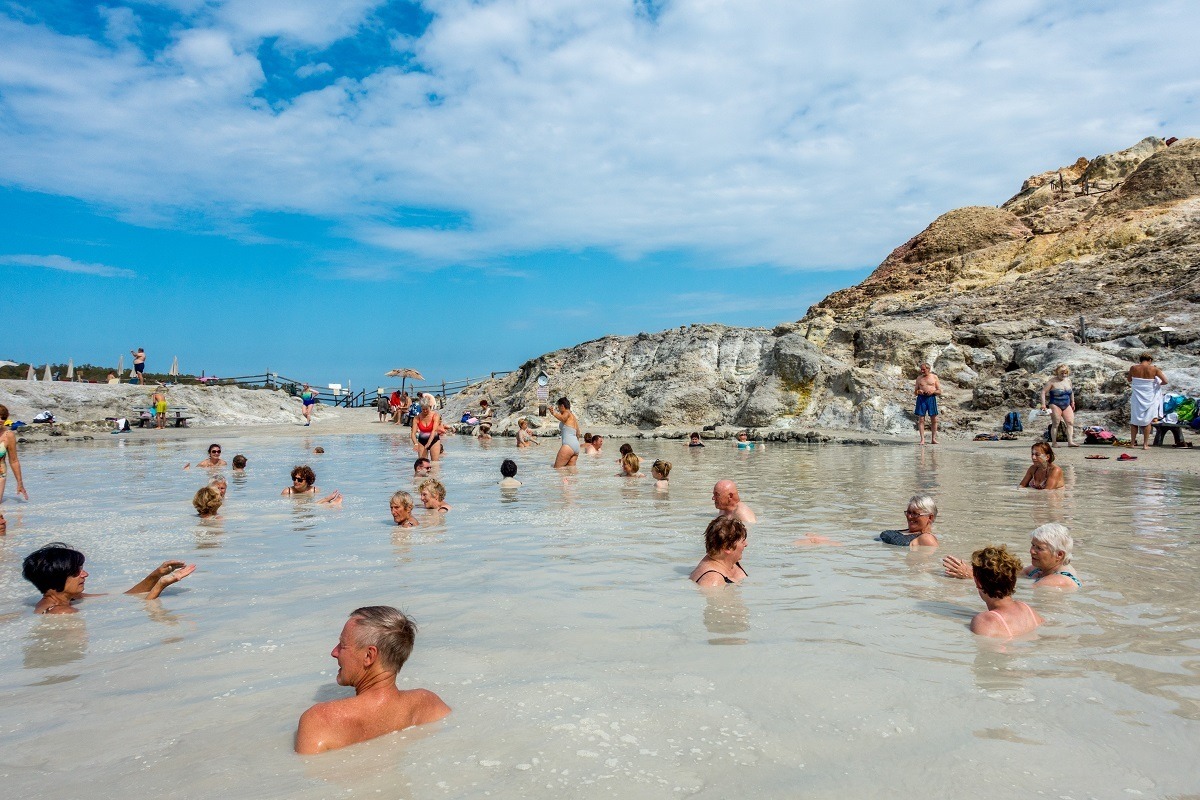 People enjoying the thermal mud bath and hot sulfur spring waters