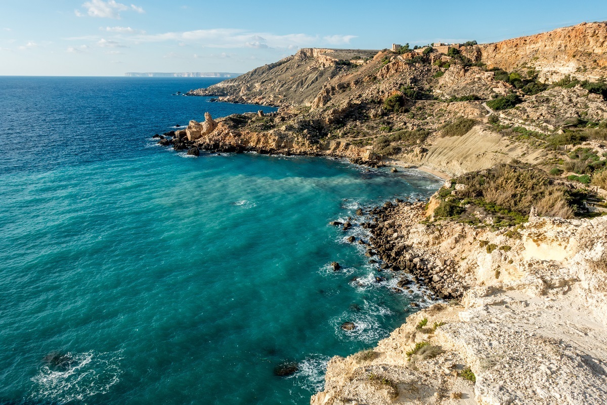 Fomm ir-Rih Bay with cliffs sloping to the ocean
