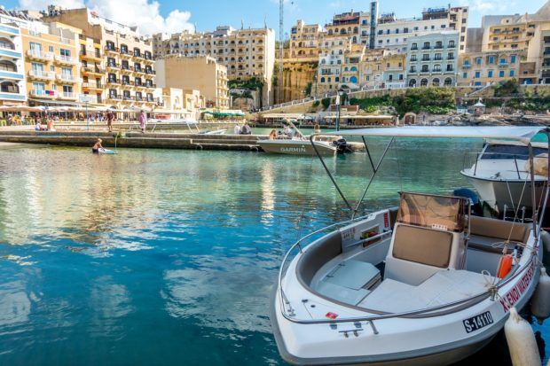 Boat in Xlendi bay in Gozo off the coast of Malta