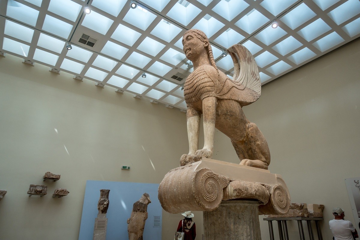 Delphi travel guide: The Spinx of Naxos in the Delphi Archaeological Museum. This is one of the many figures from Delphi Greek mythology in the museum.