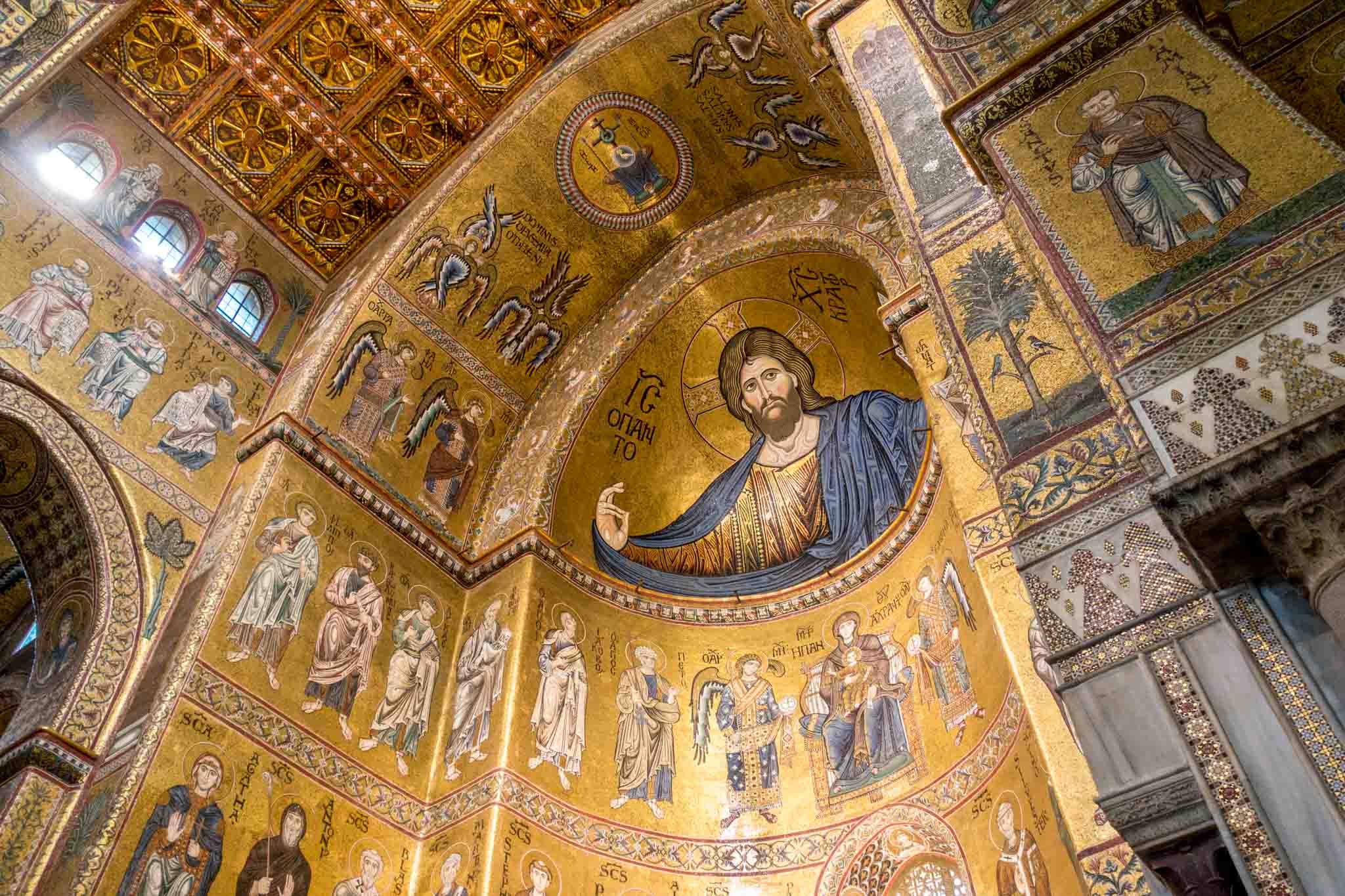 Large tile and gold mosaics of Jesus and the saints in Monreale, Sicily