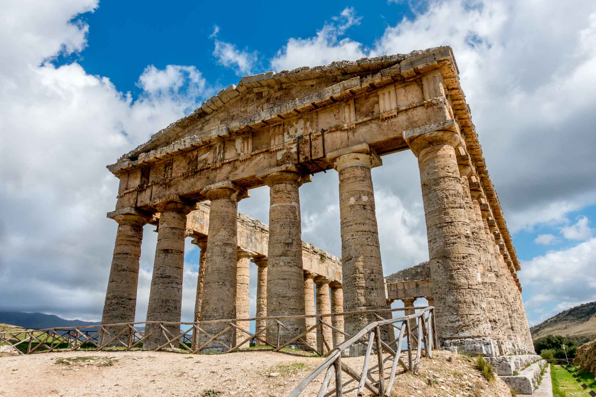 Close up of the front of an unfinished temple with columns