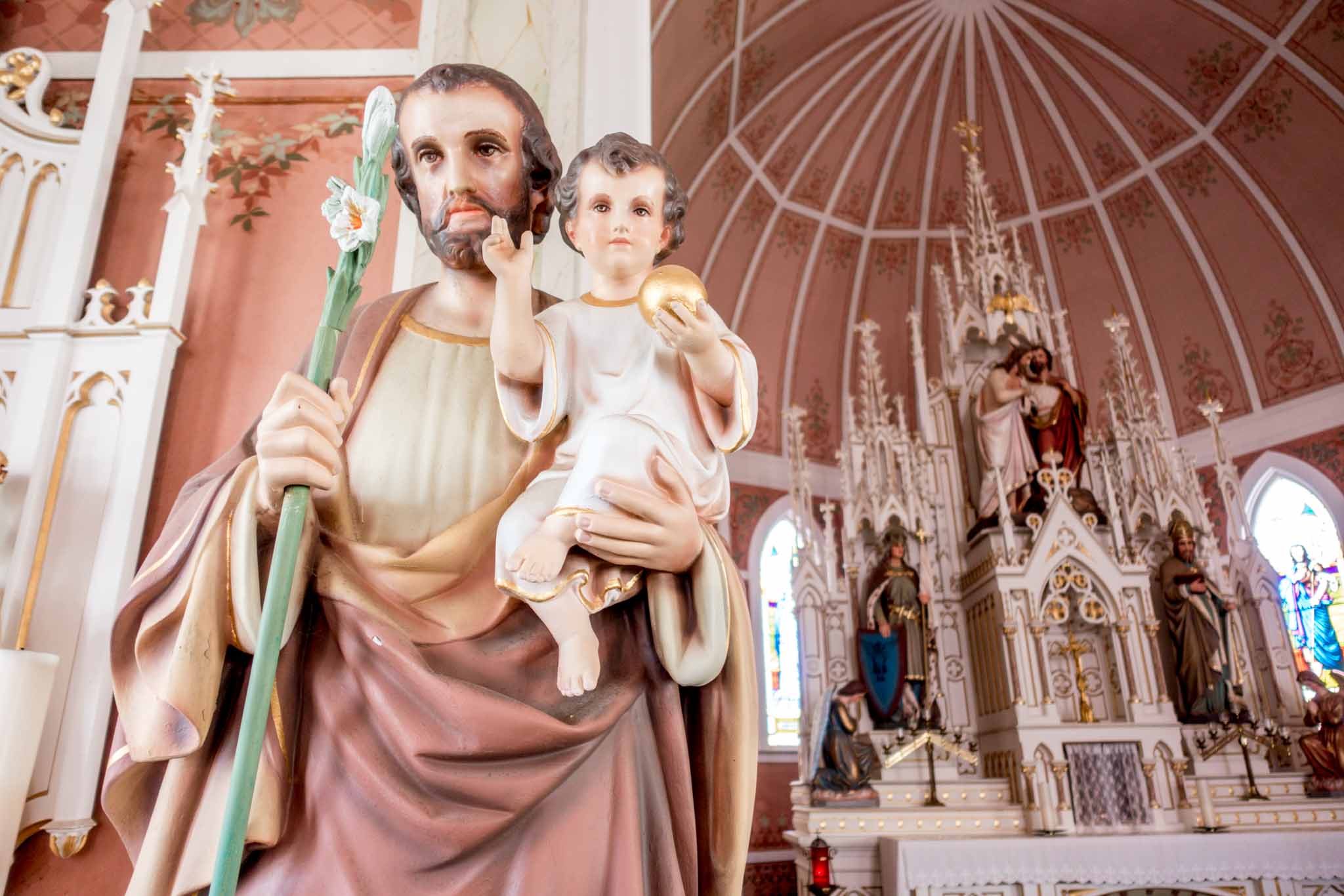 Statue of Joseph and Jesus near the altar at a Texas painted church