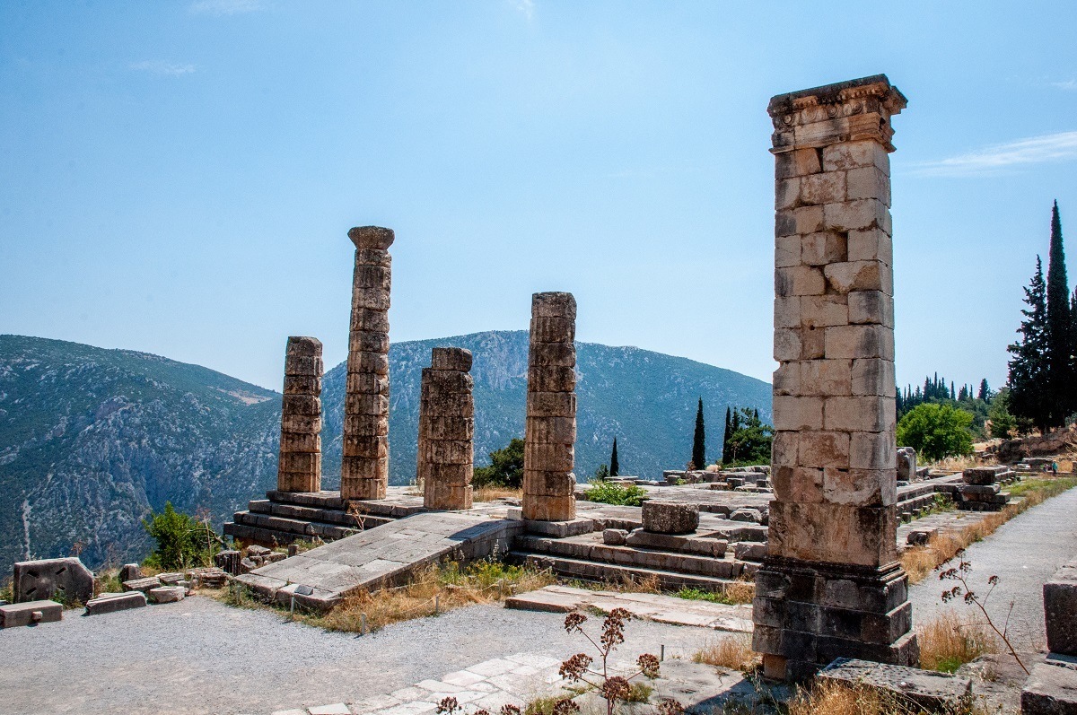 Temple of Apollo Delphi photos. This is where the Oracle presided and translated for the god Apollo. The Delphi location in the mountains also offers stunning views!