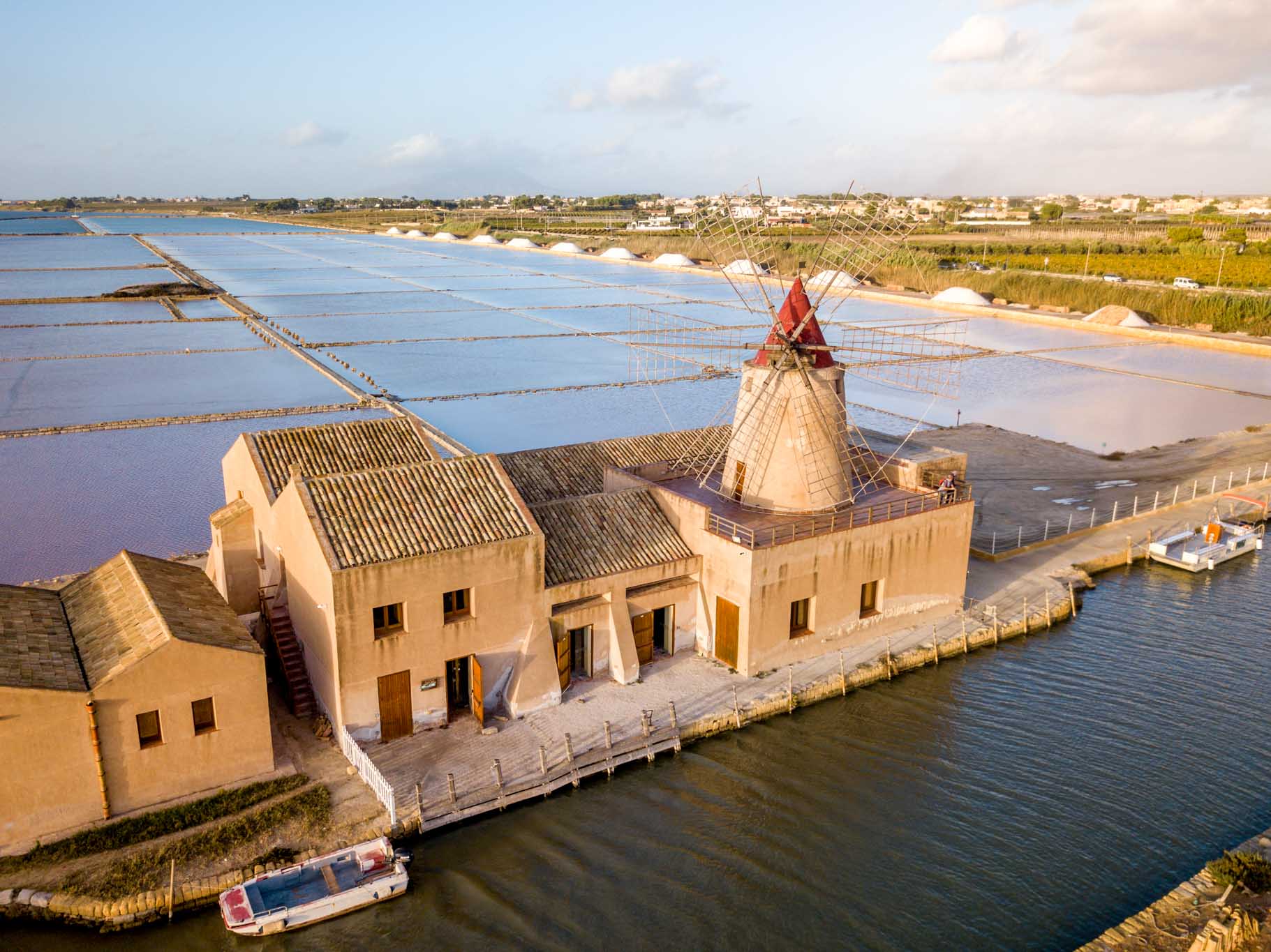 Overhead view of the salt flats of Trapani and a salt mill
