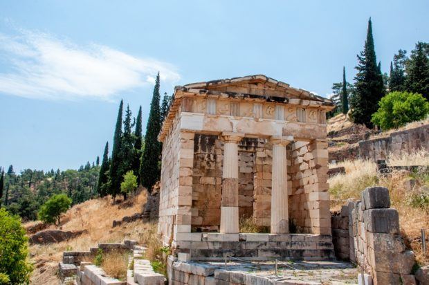Delphi Greece photos: The reconstructed Treasury of the Athenians housed gifts and dedications from visitors. The building was reconstructed from the remains of the Athenian Treasury and the Siphnian Treasury. The Treasury of the Siphnians no longer exists.