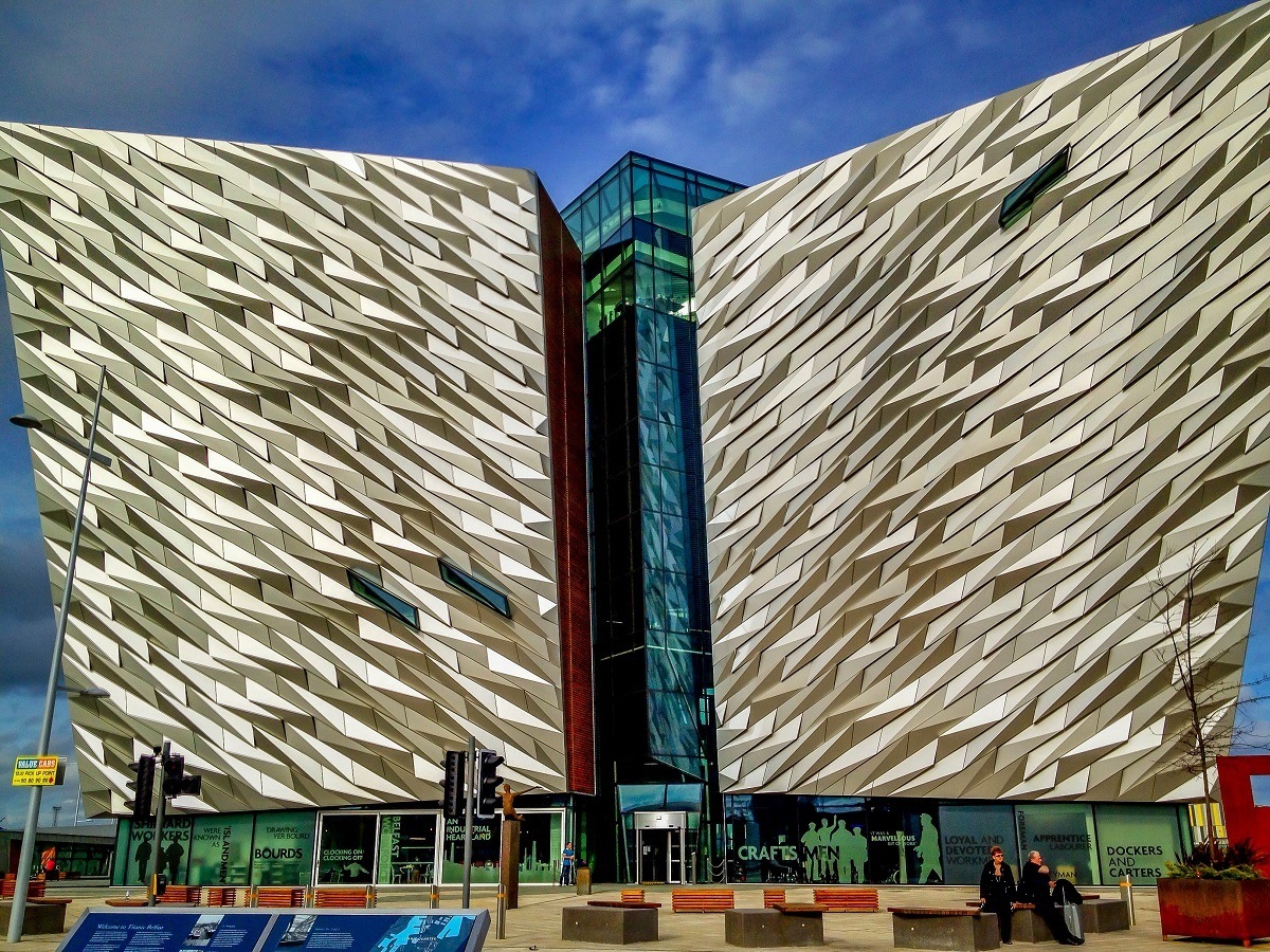 Exterior of a large building with silver-colored and glass walls, the Titanic Belfast