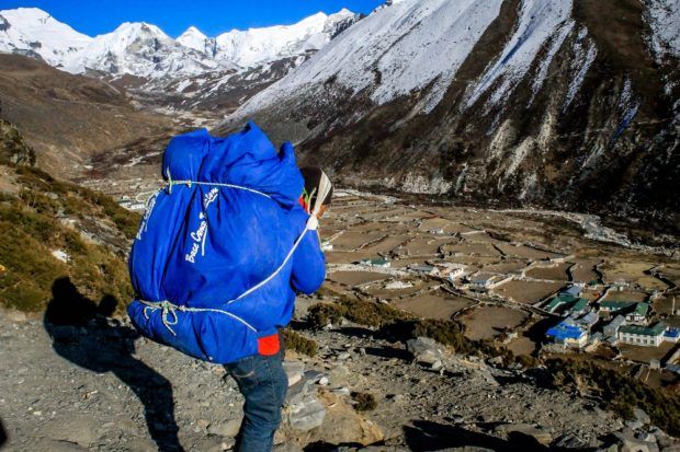 What is sherpa? It is a race, a profession and a proper name all in one. Sherpas are the backbone of life in the Himalaya Mountains. Sherpas make the Nepal trekking seasons possible. Photo courtesy of Susan Green.