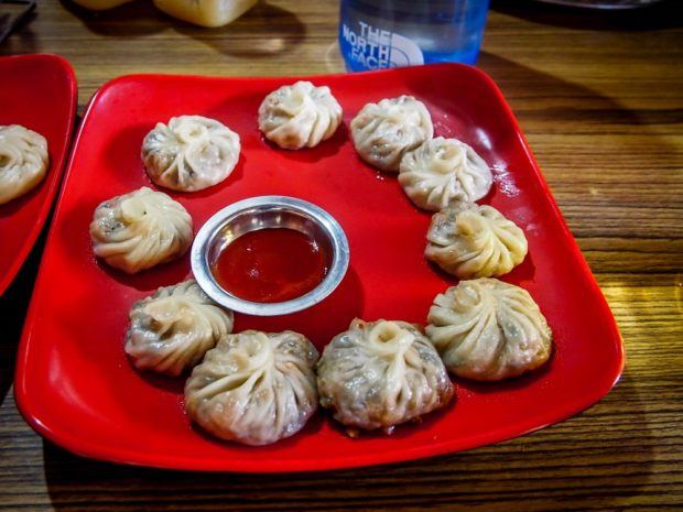 One of my favorite things while tea house trekking Nepal was eating the momo dumplings. They were filling and cheap - the perfect trekking food. Visitors can keep trekking in Nepal costs low by staying and eating at tea houses. Photo courtesy of Susan Green.