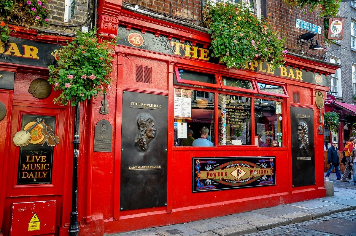 Red exterior of Dublin's Temple Bar, a highlight of a driving in Ireland itinerary 7 days