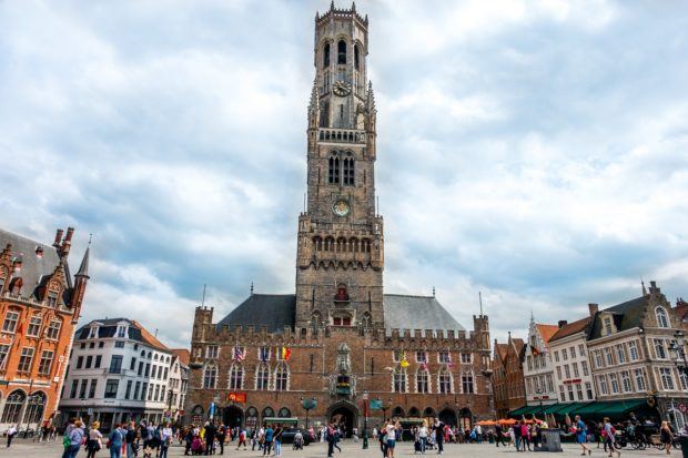 On a day trip to Bruges, Belgium, visit Markt Square and the bell tower