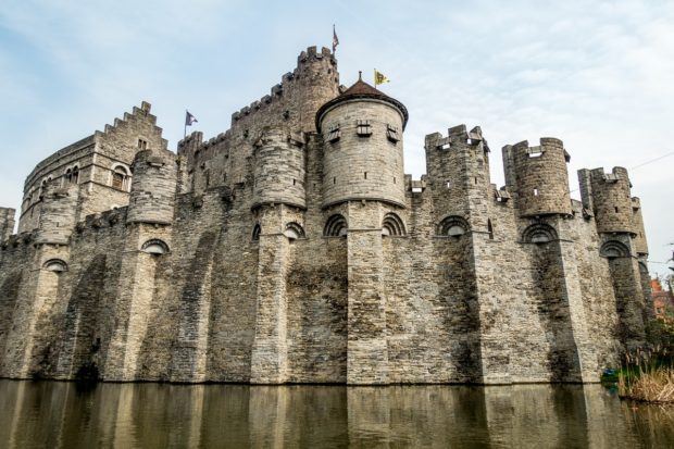 Imposing Gravensteen (also known as the Castle of the Counts or Ghent Castle) looms above the Lys River in Belgium