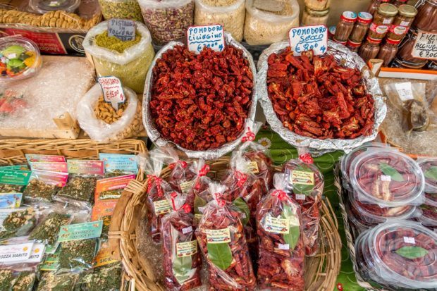 Sundried tomatoes and spices at the Capo market in Palermo, Italy.