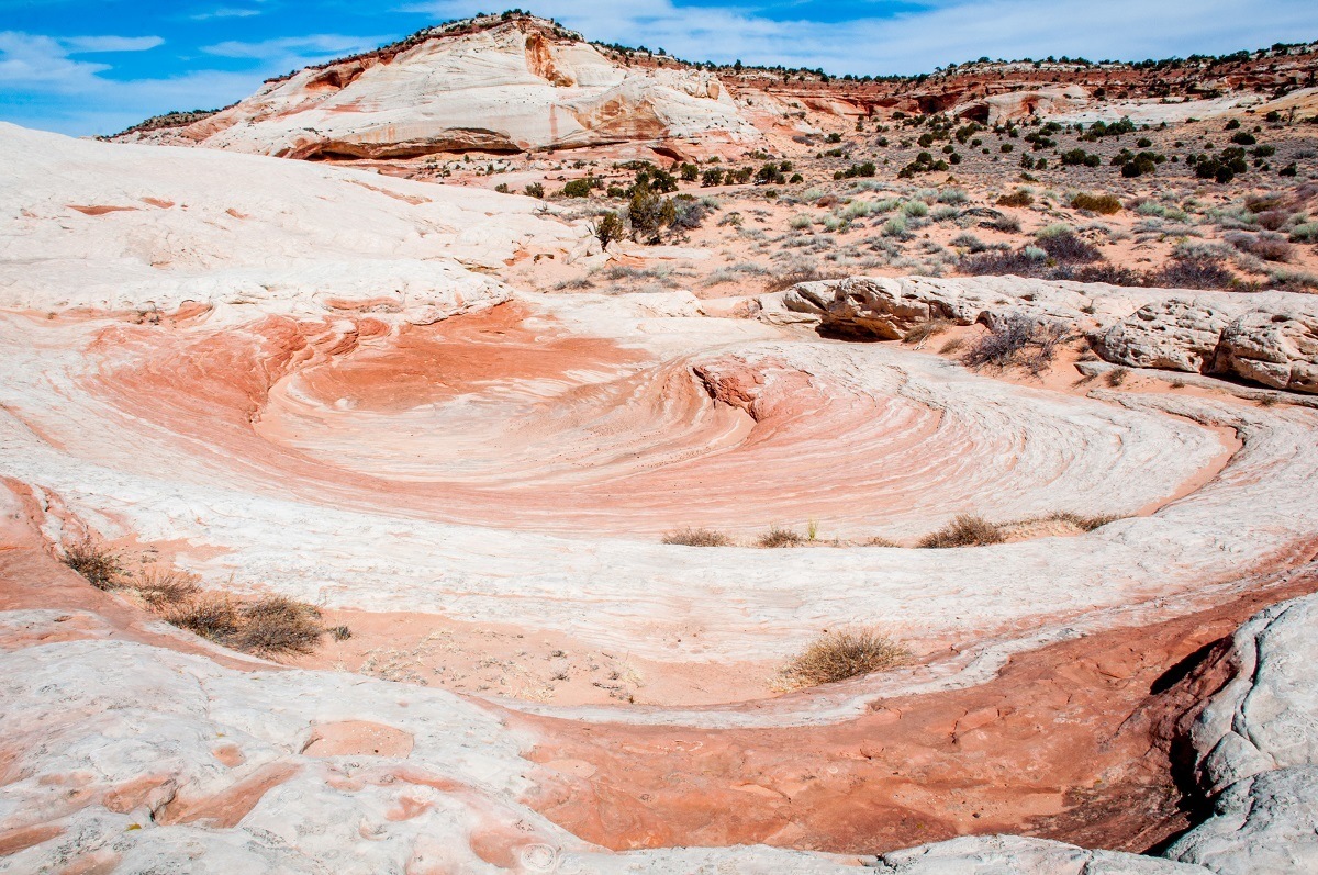 If you do your own White Pocket tour in the Vermilion Cliffs, you'll be able to see incredible rock formations like this swirl. You can get more details from the Kanab Visitor Center, including the latest road conditions, the Kanab weather report and other details.