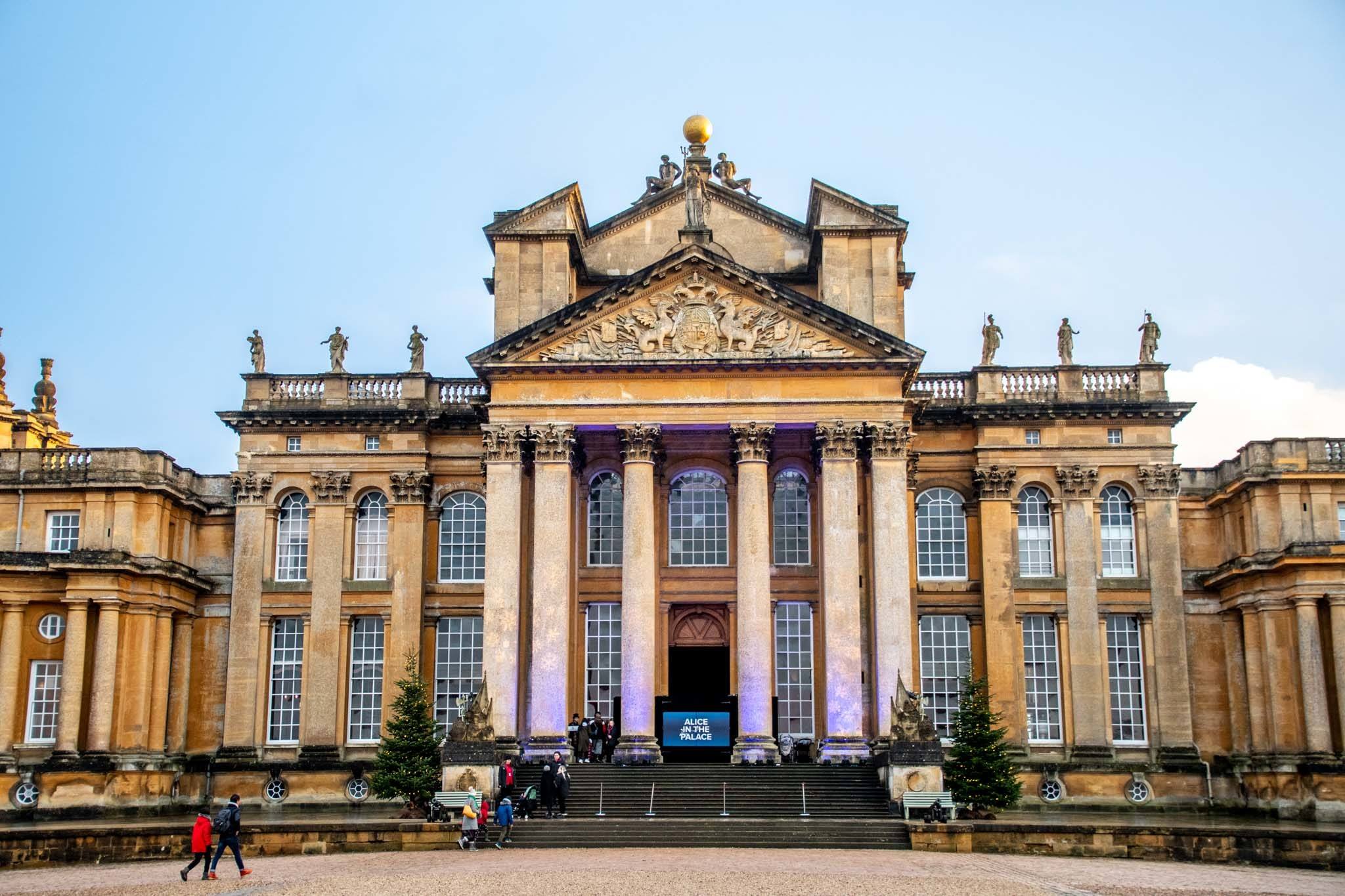Exterior of Blenheim Palace, a large stone home with a collonaded porch