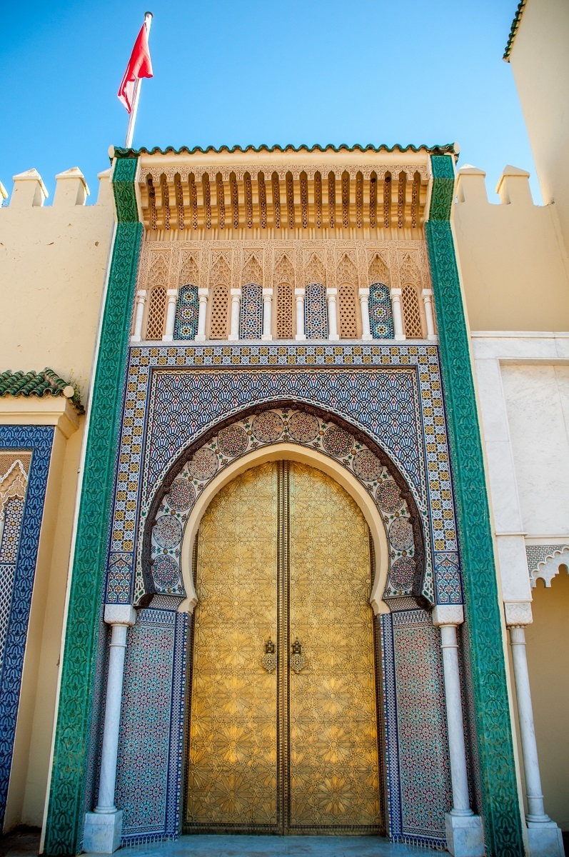 Golden and tiled gates at the Royal Palace in Fez