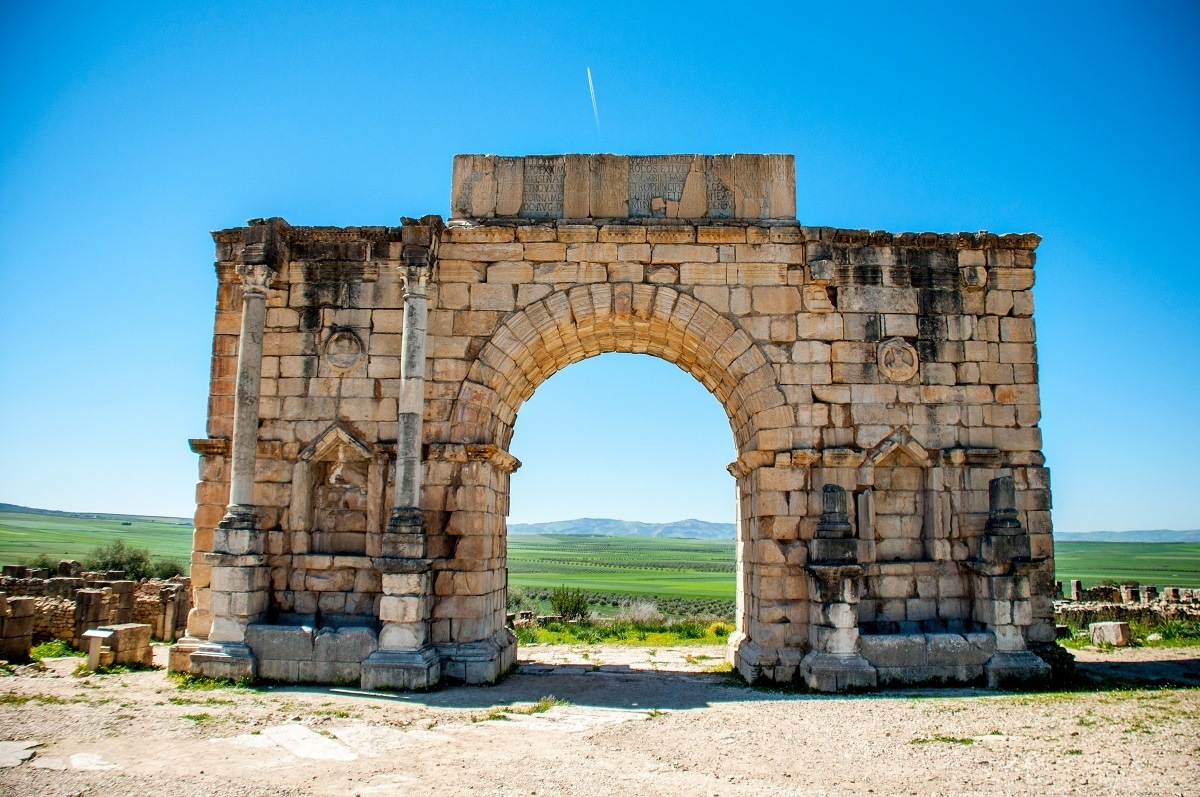 Seeing the triumphal arch at the ruins of Volubilis is one of the interesting things to do in Morocco