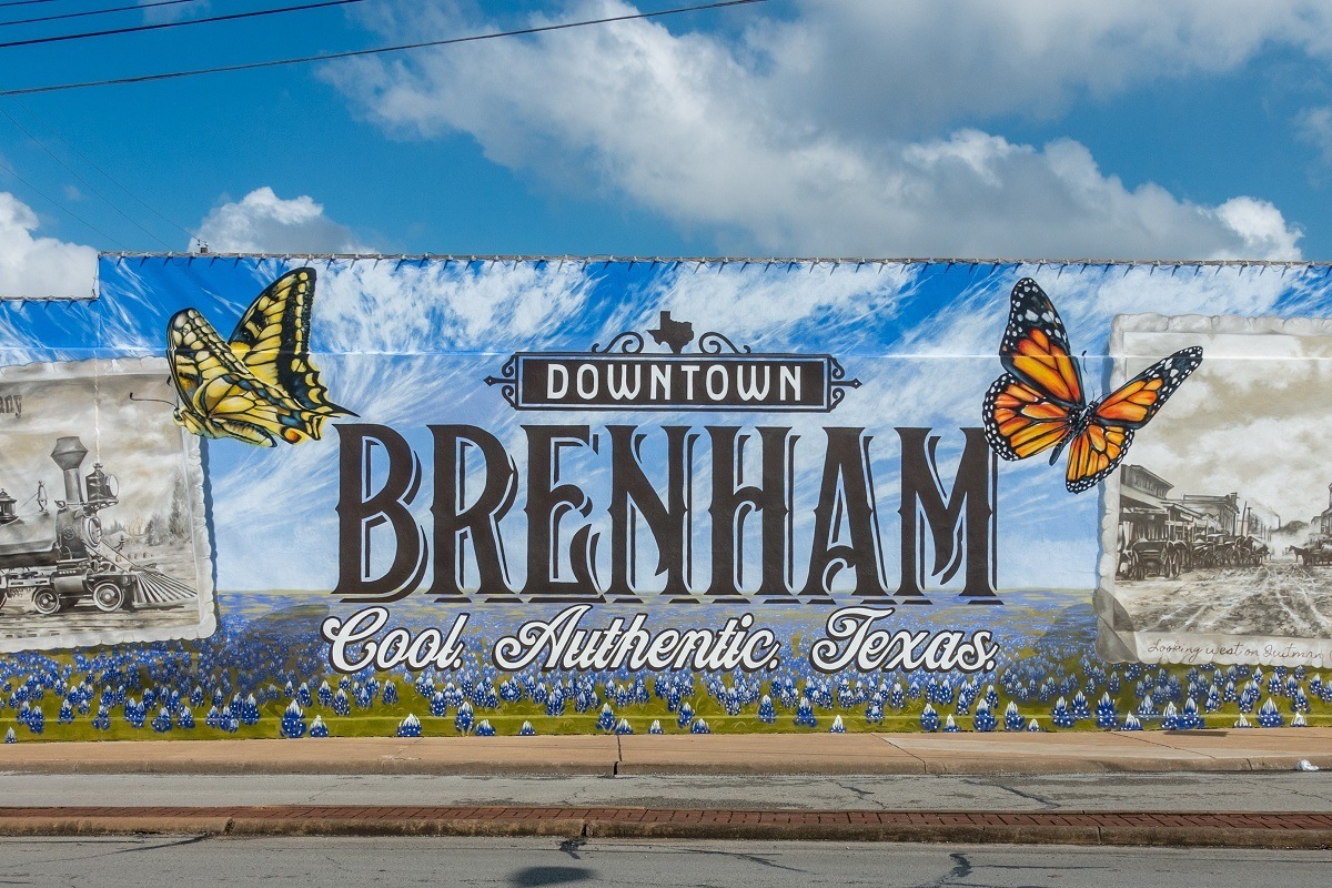 Butterfly mural labeled "Downtown Brenham: Cool. Authentic. Texas"