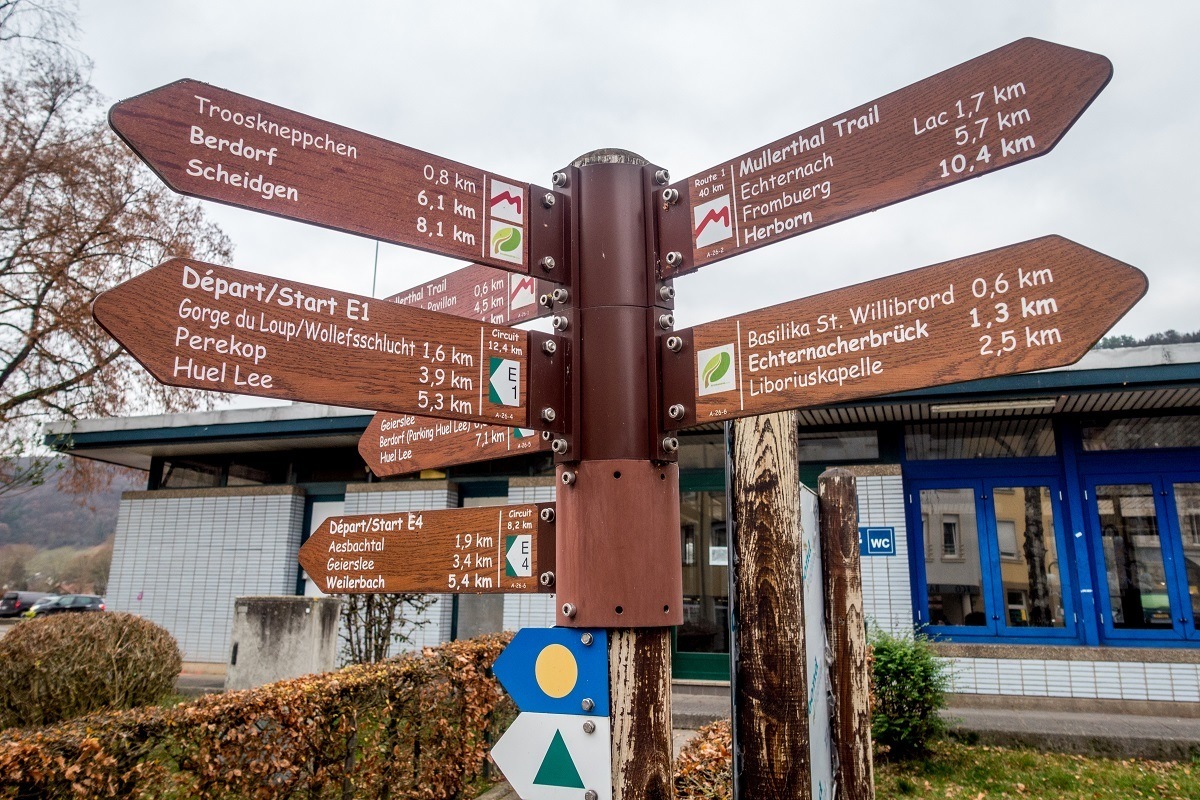 Signs showing distances to different hiking trails